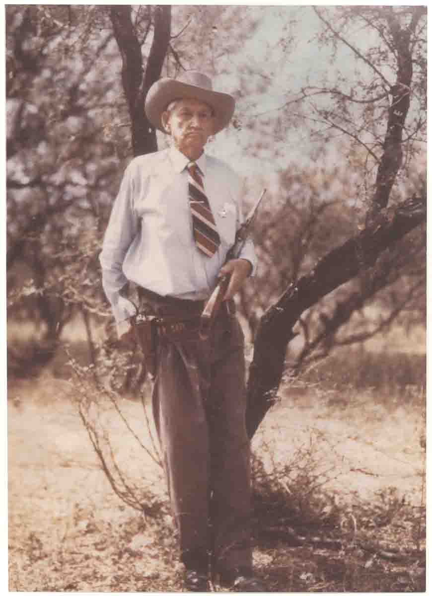 Joe Pearce was an Arizona Ranger with badge No. 13. This photo was taken circa 1958. In his hands are a Winchester Model 1895 Carbine .30 U.S. and a pearl-handled Colt Single Action Army .45 Colt.